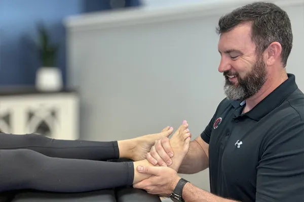 Chiropractor Wilmington NC Rhett King With Patient